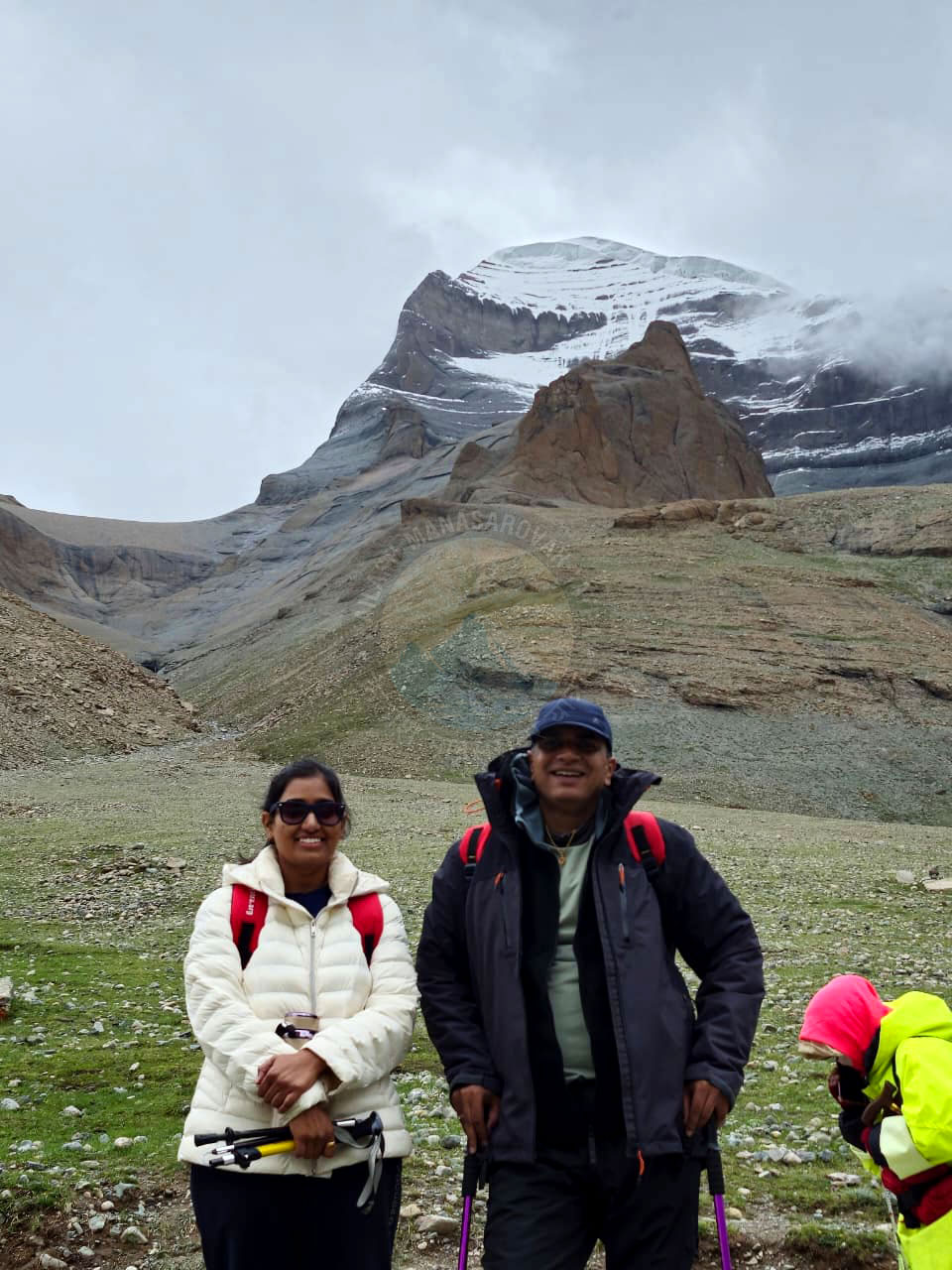 Happy couple on Kailash Mansarovar Yatra enjoying adventure and spirituality with Mount Kailash backdrop