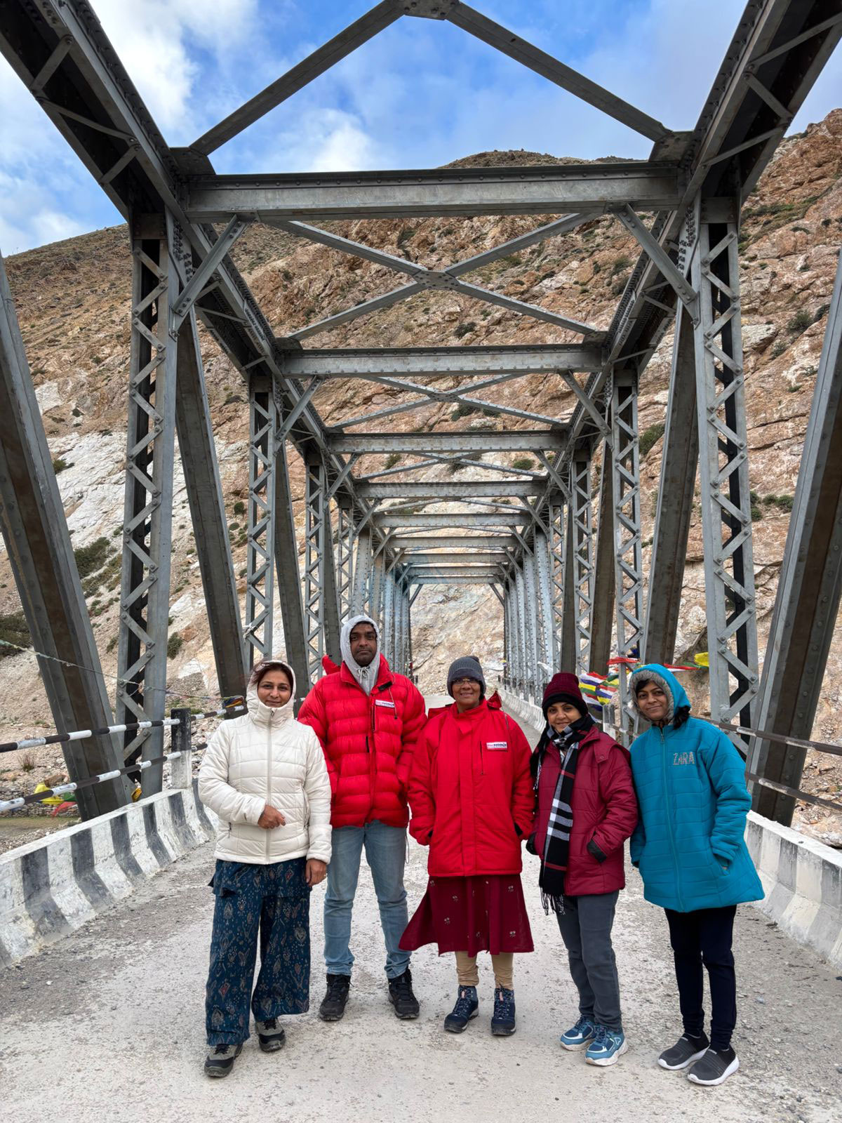Group Of Travelers On Mountain Bridge