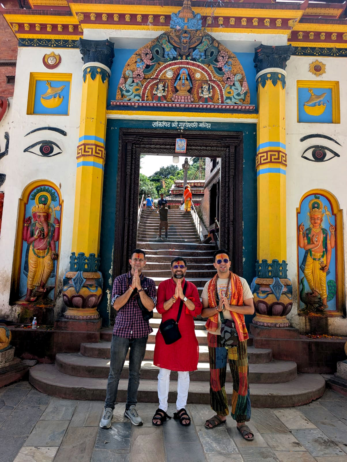Pilgrims with folded hands at the sacred Pashupatinath Temple in Kathmandu, starting their spiritual Kailash Yatra, surrounded by an atmosphere of peace and reverence.