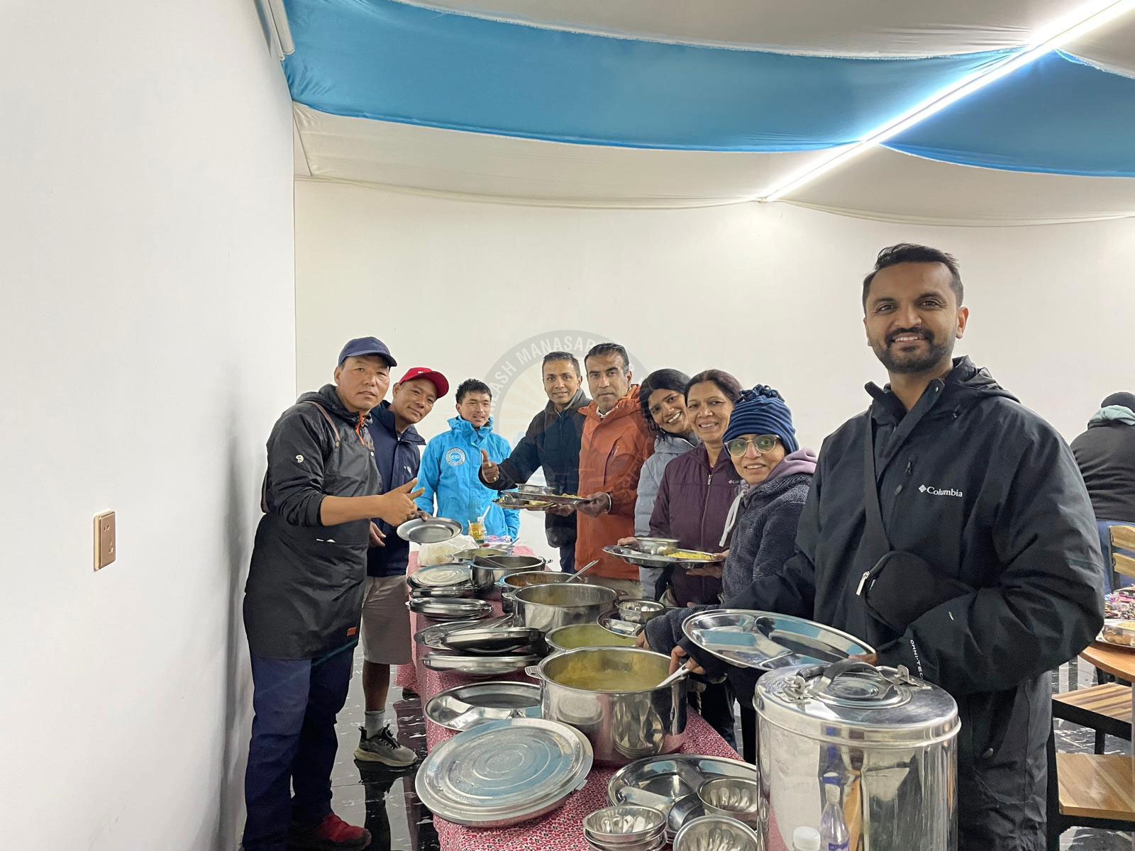 Pilgrims enjoying freshly prepared vegetarian meals during their Kailash Yatra