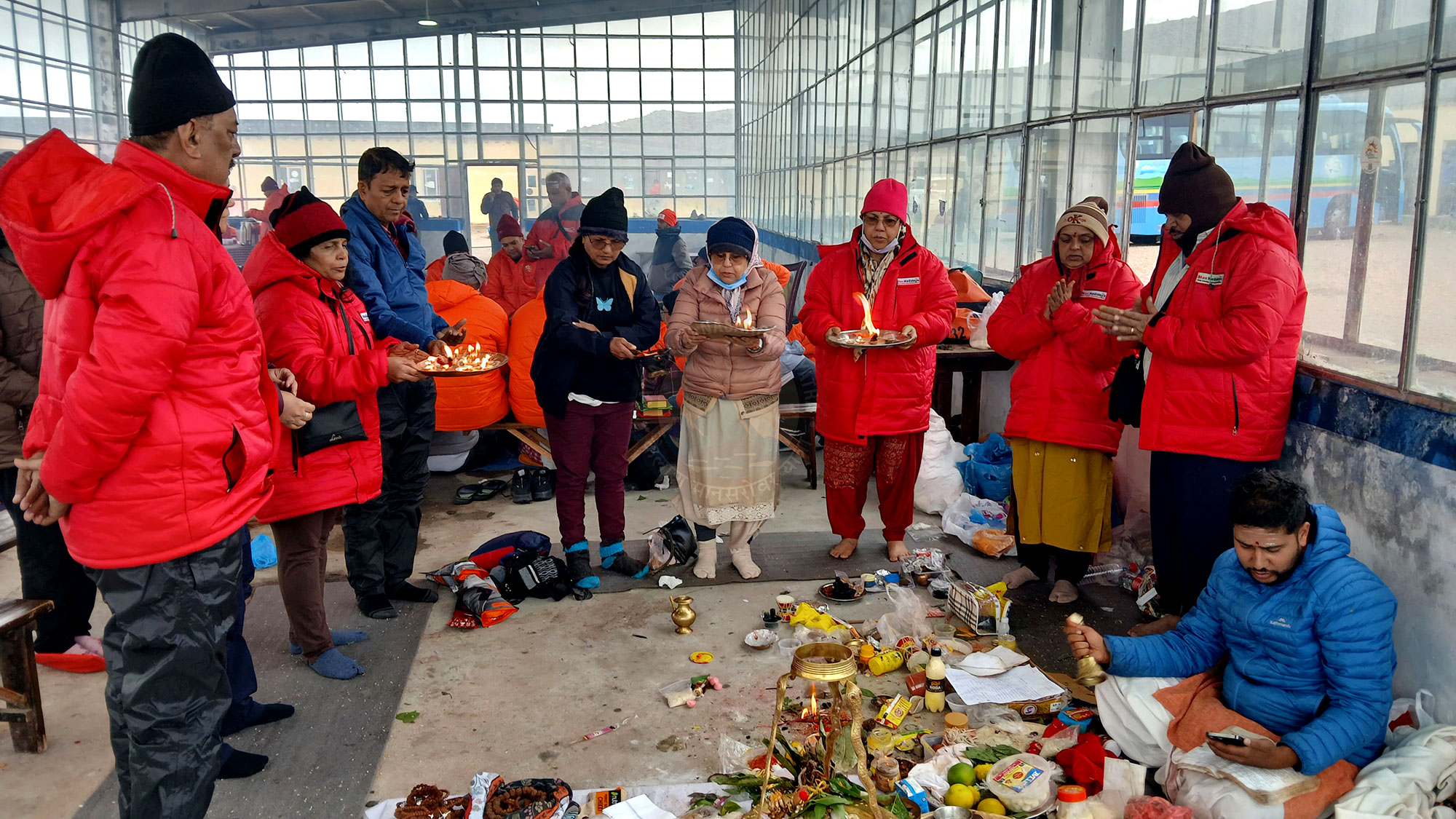 Pilgrims performing puja with complete arrangements during Kailash Mansarovar Yatra