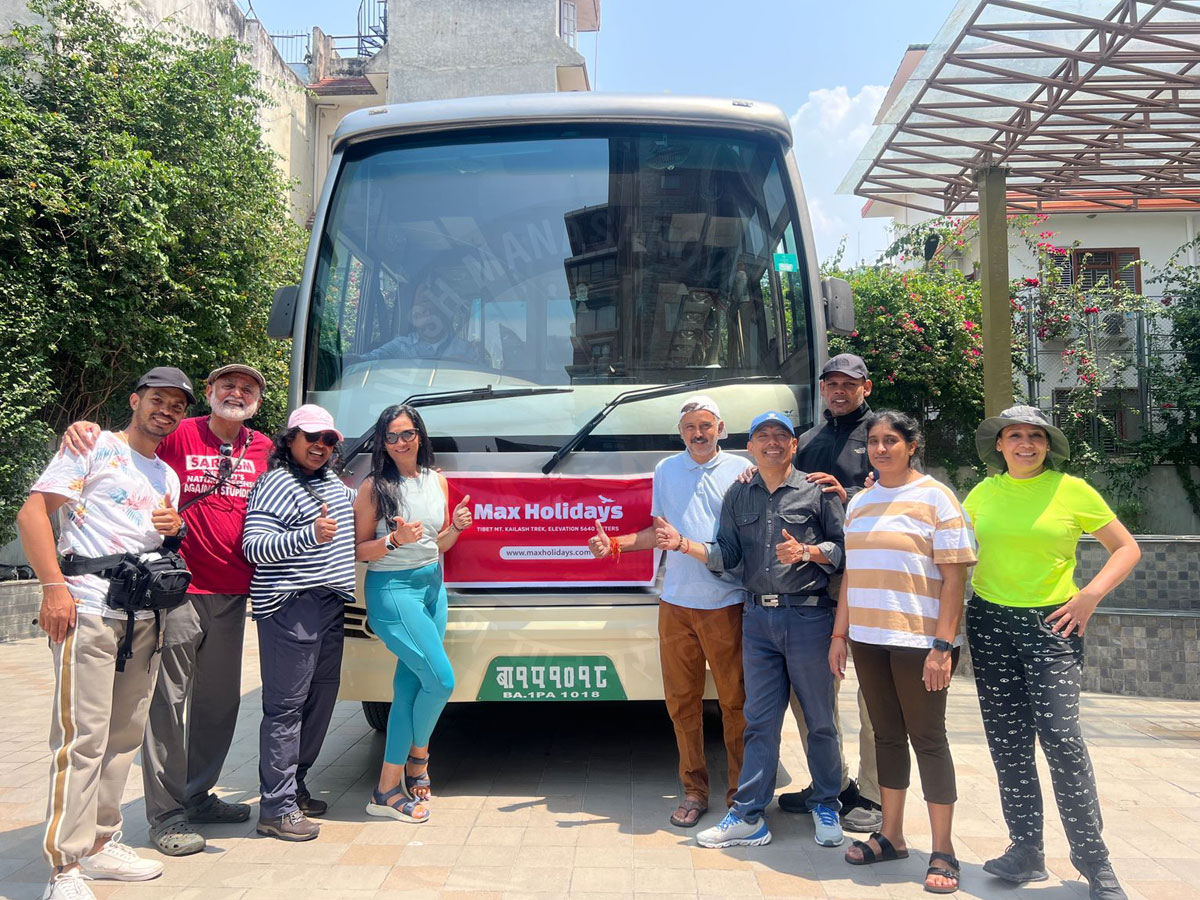Pilgrims group starting Kailash Mansarovar Yatra with Max Holidays tour bus