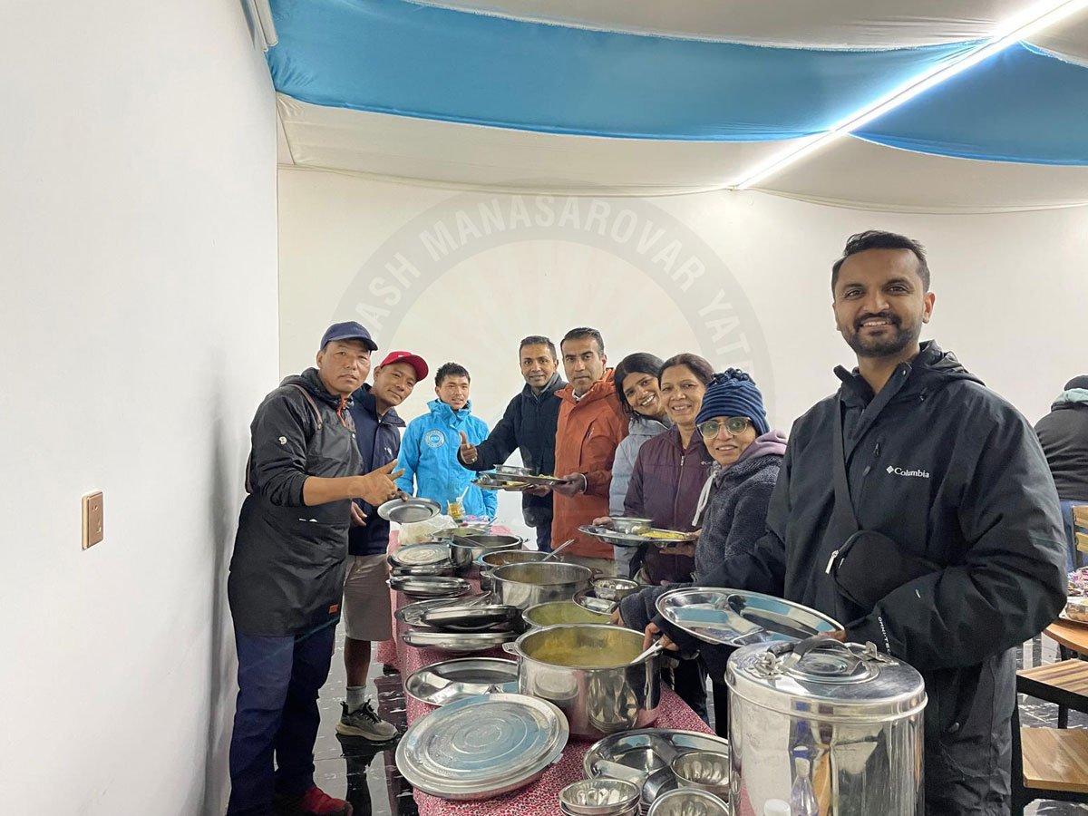 Kailash Mansarovar Yatra pilgrims having dinner together during the spiritual journey