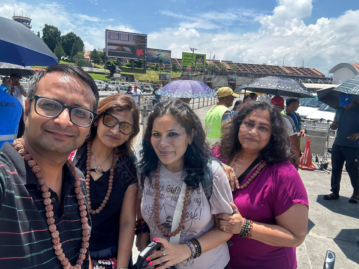 Group of devotees on Kailash Mansarovar Yatra wearing Rudraksha malas during pilgrimage journey