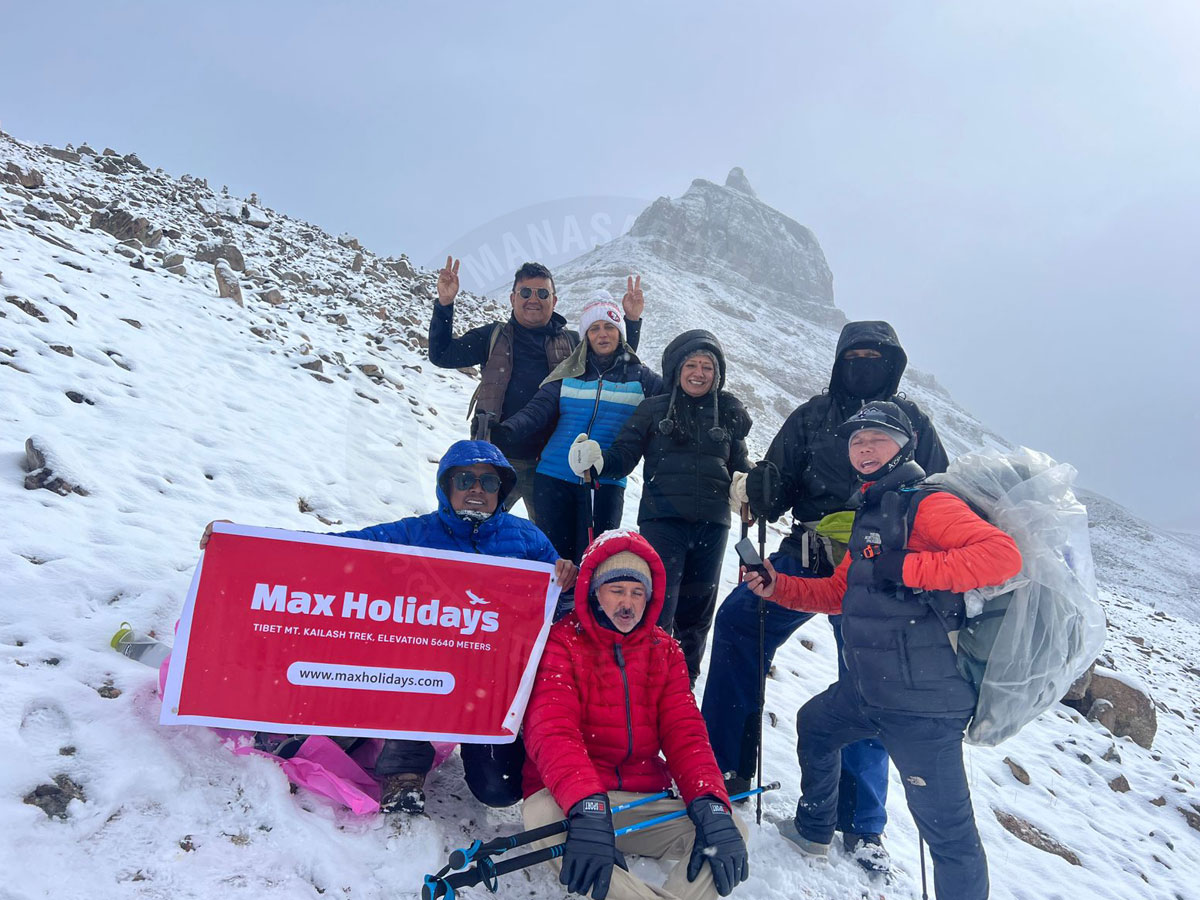Pilgrims trekking during Kailash Mansarovar Yatra with Max Holidays group in snowy mountains