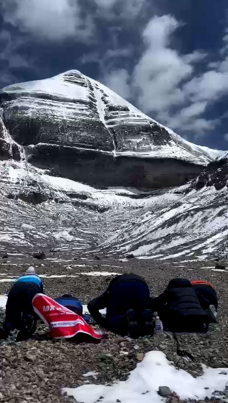 Devotees praying at Mount Kailash for blessings